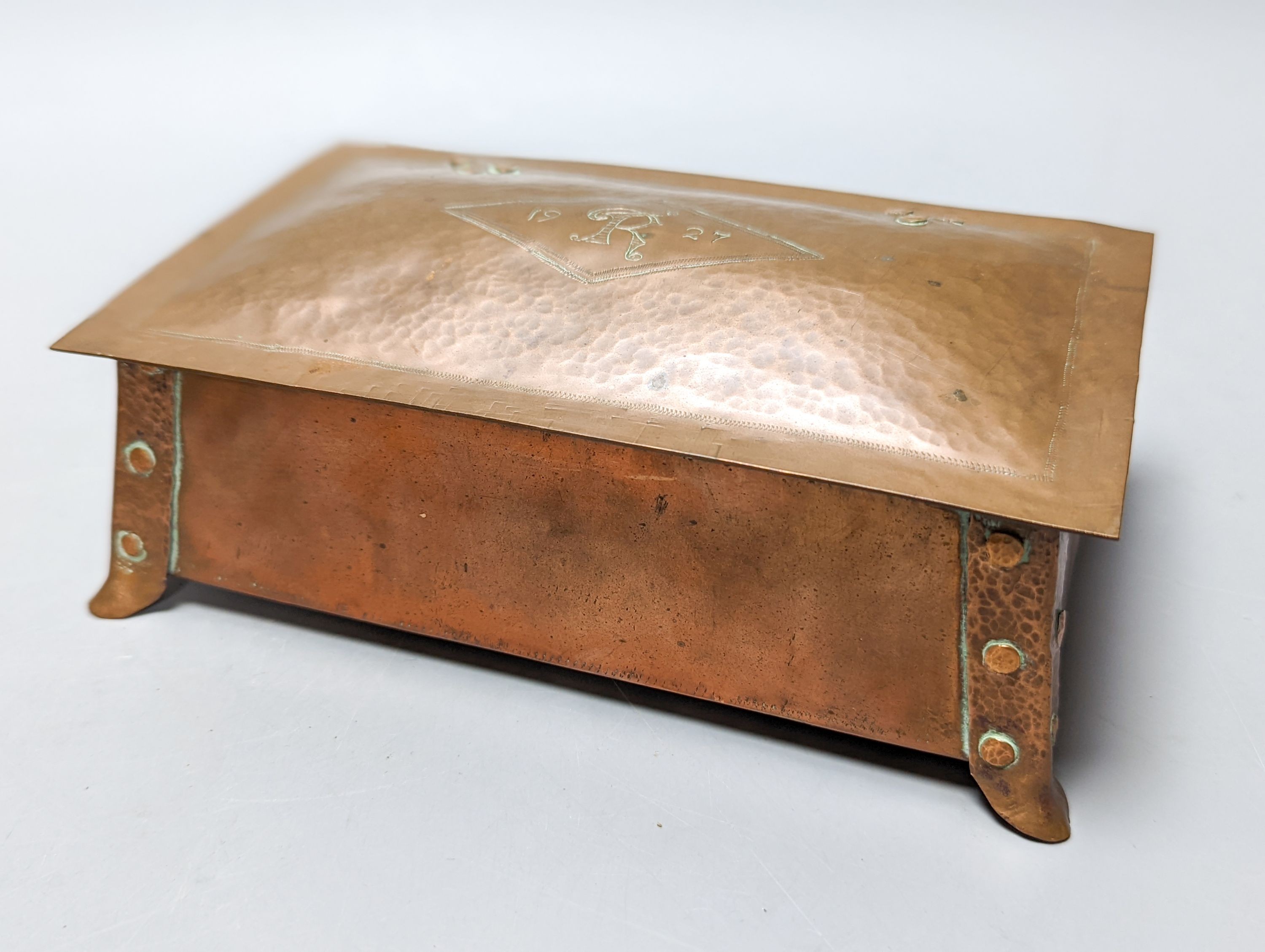An Arts and Crafts brass/copper group - figural gimbal lamp, mantle timepiece, lidded box etc.
